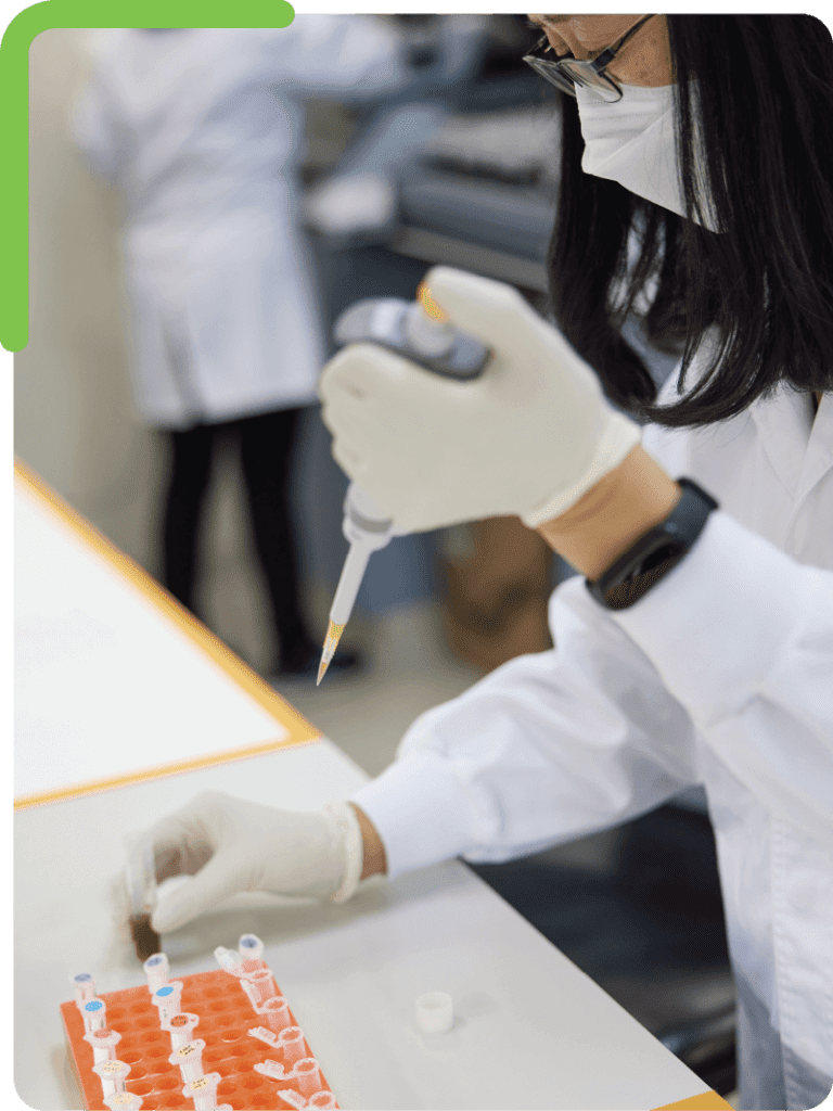 A scientist preparing samples in stacked tubes for DNA analysis