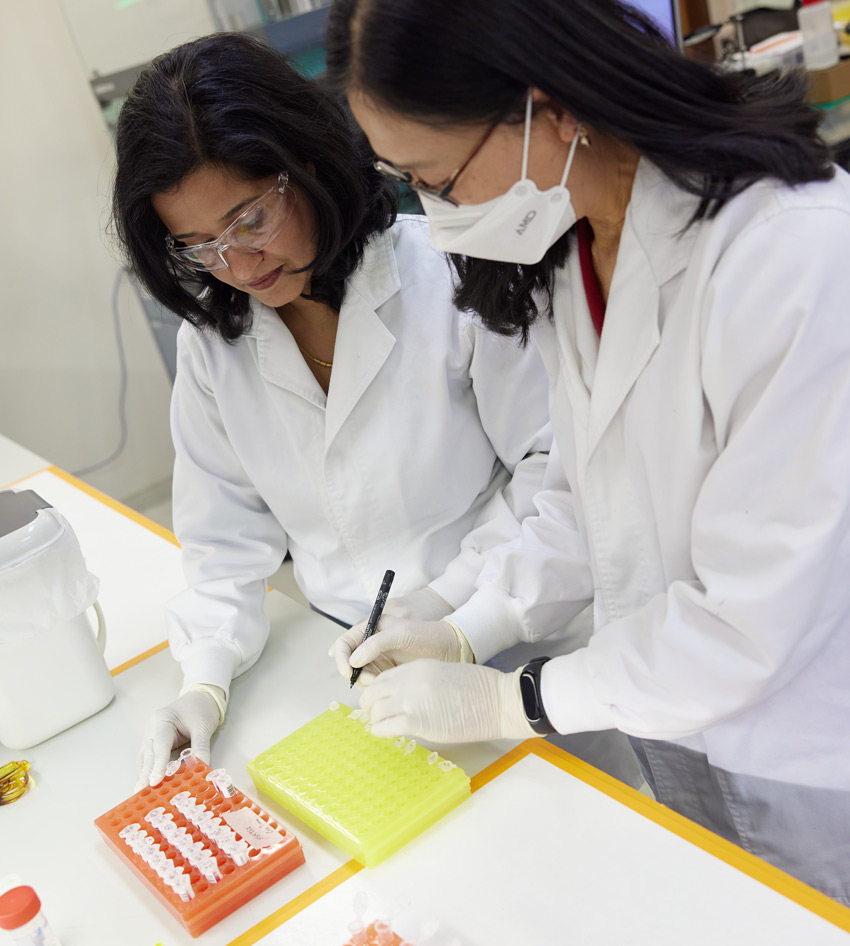 Geneticists assessing samples for plant, seed and animal genomic analysis in a laboratory