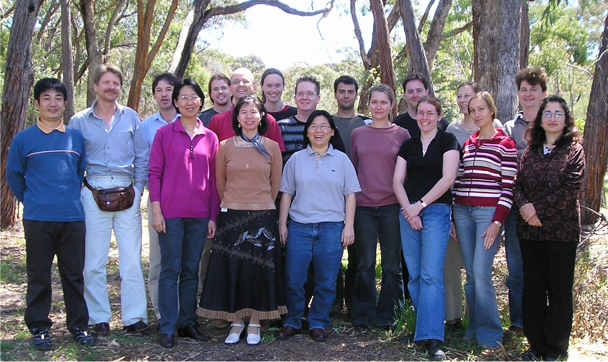 Diversity Arrays Technology staff standing in a forest